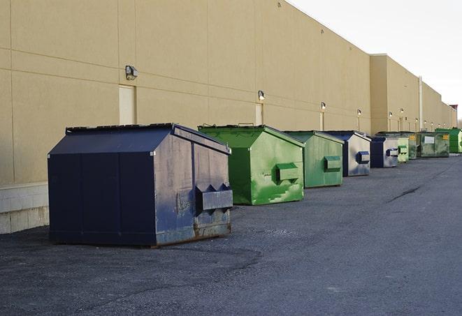 a crowd of dumpsters of all colors and sizes at a construction site in Brownsville OR